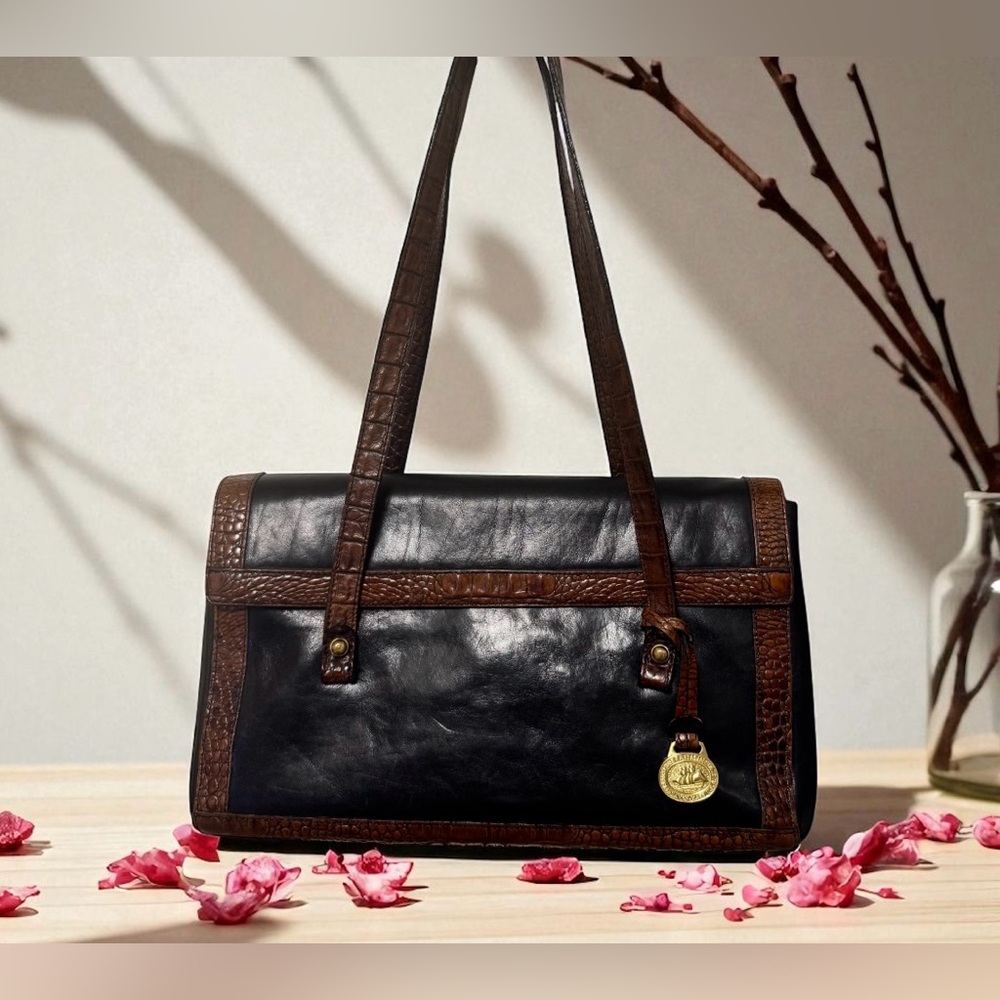 Vintage Brahmin Black Leather Shoulder Bag with Brown Trim and Medallion